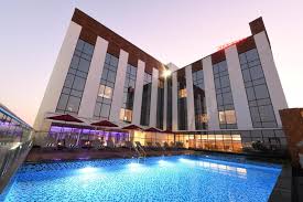 Premium hotel exterior in Shimoga where Extraordinary Experience attendees stay
